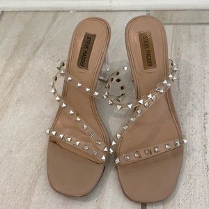 Clear studded low block heels.